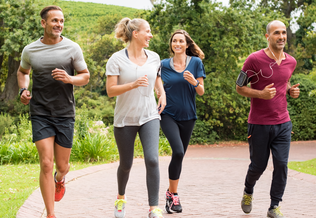 A group exercising. Exercise can help prevent painful conditions.